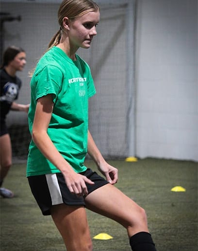 teen taking a semi private training soccer class